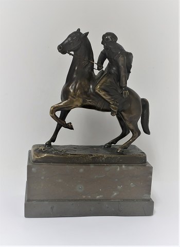 Bronze figure. Bedouin on horseback. Height 21 cm. Stamped; In the desert.