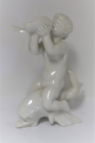 Bing & Grondahl. Porcelain figure. Kai Nielsen. Sea child on dolphin, blanc de 
chine. Height 18 cm. (1 quality)