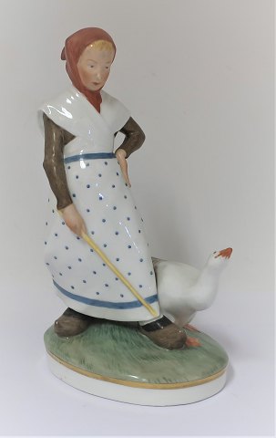 Royal Copenhagen. Porcelain figure. Goose girl in colors. Model 528. Height 18.5 
cm. (1 quality)