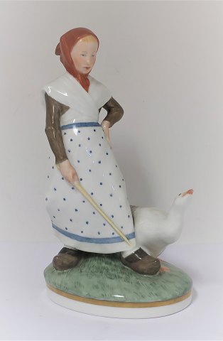Royal Copenhagen. Porcelain figure. Goose girl in colors. Model 528. Height 18.5 
cm. (1 quality)