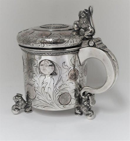 Silver mug with inlaid coins (830). Height 19.5 cm.