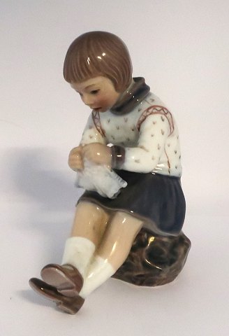 Dahl Jensen. Porcelain figure. Grethe with knitting clothes. Model 1197. Height 
14.5 cm. (1 sort)