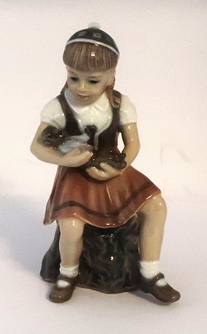 Dahl Jensen. Little girl with a teddy bear. Model #1295. Height 15 cm. (1 quality)
