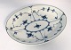 Royal Copenhagen. Mussel painted, fluted. Oval salad dish. Model 24. Length 25 
cm. Width 19.5 cm. (1 quality).