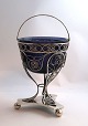 Frederik Mortz Klose, Copenhagen. Silver candy bowl in filigree with blue glass 
insert. Height 15.5 cm. Produced 1814. Glass has minor damage. (See photo)