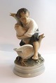 Royal Copenhagen. Porcelain figure. The Goose Thief. Model 2139. Height 17 cm. 
(3 quality)