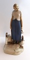 Bing & Gröndahl. Porcelain figurine. Goose girl. Model 2254. Height 24.5 cm. (2 
quality).