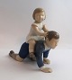 Bing & Grondahl. Porcelain figure. Brother and sister. Height 15.5 cm. (1 
quality)