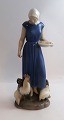Bing & Grondahl. Porcelain figurine. Chicken girl. Model 2220. Height 23.5 cm. 
(1 quality).