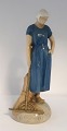 Bing & Grondahl. Porcelain figurine. Girl with rake. Model 2050. Height 27 cm. 
(2 quality).