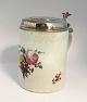 Royal Copenhagen. Lidded mug decorated with flowers with silver lid. Lid not 
stamped. Height 17 cm. Diameter 12 cm