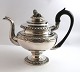 Levin Dyrkopf, Copenhagen (1790-1843). Silver teapot (830). Decorated with a 
reclining lion on top. Height 21 cm. Produced 1835.