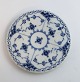 Royal Copenhagen. Blue fluted, half lace. Heating pad. Model 736. Diameter 13 cm. Slight wear on the glaze. (1 quality). Produced before 1923
