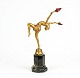 Art Deco cold-painted bronze on stepped black marble base, circa 1920. By Johann Philipp Ferdinand Preiss ( Germany 1882-1943 ). Model number: 1084, signed: F Preiss. Height: 14.96 in ( 38 cm ), Depth 9.84 in ( 25 cm ), Width 6.68 in ( 17 cm ) Young woman balancing on one leg, her back arched, holding up two torches, wearing only a pair of culottes