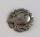 Georg Jensen. Brooch with dove in sterling silver (925). Diameter 4 cm.