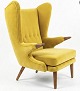 Stunning, newly upholstered Svend Skipper "Teddy Bear" chair in exquisite yellow fabric. Teak nails and legs.